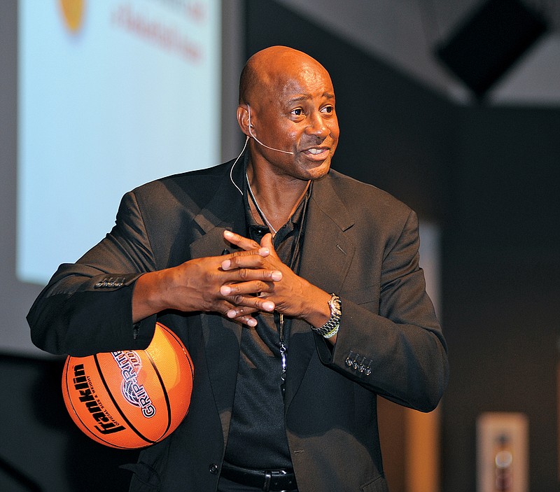 The Sentinel-Record/Mara Kuhn ONE TEAM: Former Arkansas and professional basketball player Sidney Moncrief speaks about team-building and leadership Thursday during the Arkansas School Board Association Summer Leadership Institute at the Hot Springs Convention Center. Moncrief spoke about building "One Team" in every school district.