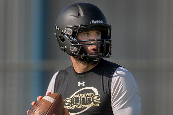 Charleston quarterback Ty Storey drops back to pass against Coweta (Okla.) on Friday, July 11, 2014, during the Southwest Elite 7-on-7 Showcase at Shiloh Christian School in Springdale.