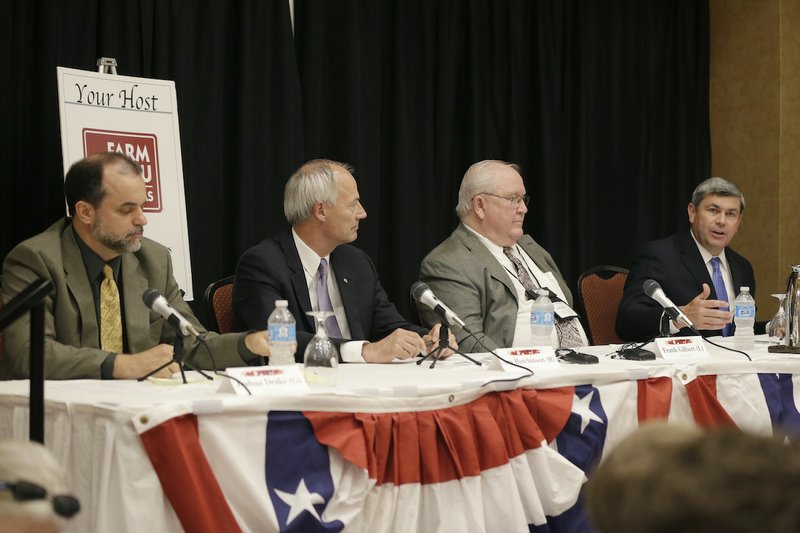 Candidates for Arkansas governor, from left, Green Party Joshua Drake, Republican Asa Hutchinson, Libertarian Frank Gilbert and Democrat Mike Ross participate in a debate at the Arkansas Press Association convention in Hot Springs, Ark., Friday, July 11, 2014. 