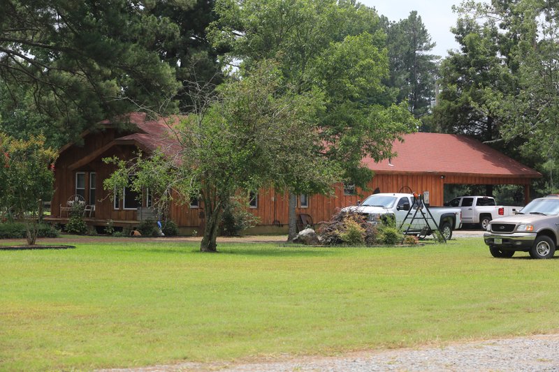 The home shown early Friday afternoon where two bodies were found slain around 7 a.m. on Cowboy Lane in Pine Bluff Friday.