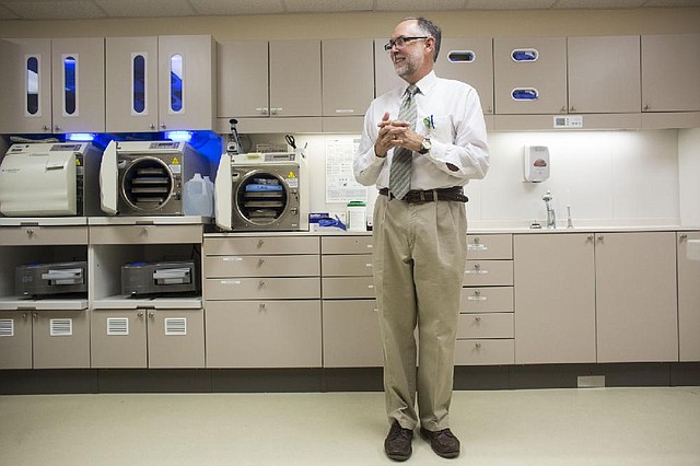 Arkansas Democrat-Gazette/Melissa Sue Gerrits - 07/11/2014 -  UAMS Associate Dean for Administrative Affairs Bill Woodell stands in the hall of new equipment unveiled at the Oral Health Clinic July 11, 2014 at UAMS.  