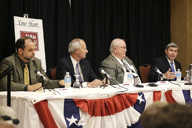 Taking part in Friday’s Arkansas Press Association gubernatorial debate in Hot Springs are Joshua Drake (from left) of the Green Party, Republican Asa Hutchinson, Libertarian Frank Gilbert and Mike Ross of the Democratic Party.