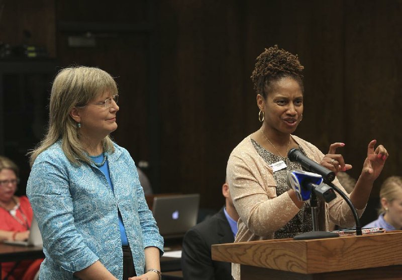 Kathy Smith (left), senior program officer of the Walton Family Foundation, and Sherece West-Scantlebury, president and chief executive officer of the Winthrop Rockefeller Foundation, answer questions Friday for the state Board of Education about a proposed philanthropic partnership with the state.