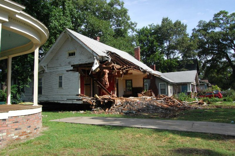 Arkansas Democrat Gazette/CAMMIE BELLAMY - 07/10/2014 - Liberty Hill Missionary Baptist Church has begun demolition on a 99-year-old house at 1312 S. Schiller St. The demolition has angered members of a local neighborhood association, who say losing the house hurts the historic integrity of the Central High School neighborhood.