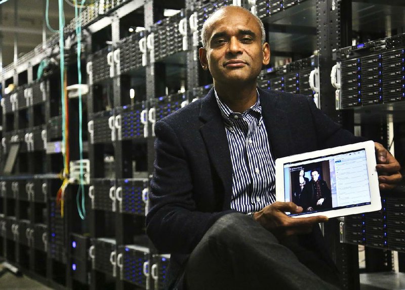 FILE - In this Thursday, Dec. 20, 2012, file photo, Chet Kanojia, founder and CEO of television-over-the-Internet service Aereo, Inc., shows a tablet displaying his company's technology, in New York. After the Supreme Court's ruling against the company, Aereo is now using the high court's own language to force broadcasters to treat it just like other cable TV companies. In Aereo’s view, that means broadcasters must license its signals to Aereo under a 1976 copyright law. (AP Photo/Bebeto Matthews, File)