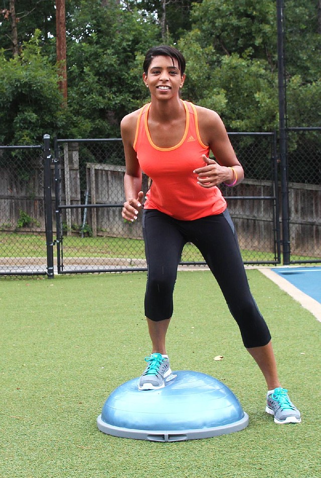 Arkansas Democrat-Gazette/CELIA STOREY
Nicky Hamilton does step 1 of the BOSU Quick Step exercise at Little Rock Racquet Club for ActiveStyle's Master Class column.