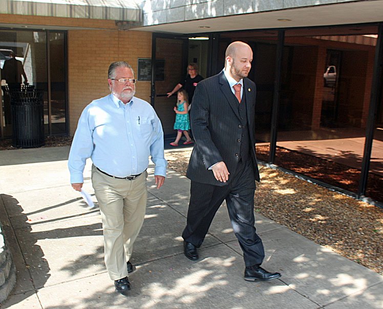 Michael Frost, left, leaves court Monday with his attorney, Parker Jones.