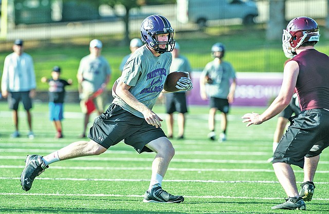 STAFF PHOTO ANTHONY REYES &#8226; @NWATONYR Drake Wymer of Fayetteville runs against the Gentry defense Monday in a 7-on-7 game at Harmon Field in Fayetteville.