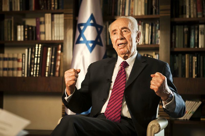 Israel's President Shimon Peres speaks during an interview with The Associated Press, at his residence in Jerusalem, Tuesday, July 15, 2014. Peres said the killing of civilians by Israeli air raids on Gaza presents a moral dilemma, but argues there is scant alternative as long as the Islamic militants who rule the coastal strip refuse to stop firing rockets at much of Israel. (AP Photo/Dan Balilty)