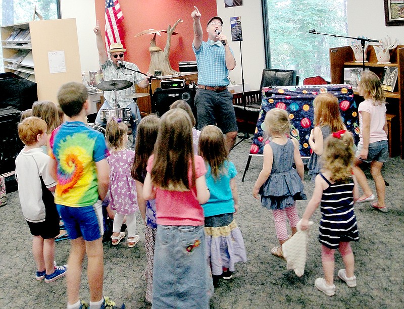Courtesy of Diane S. Hine Rob &#8220;Dr. Rock&#8221; Martin, on drums, and Chris &#8220;Boom!&#8221; Wister of Oklahoma City perform as Sugar-Free Allstars at the Bella Vista Public Library in July as part of the 2014 Summer Reading Program.