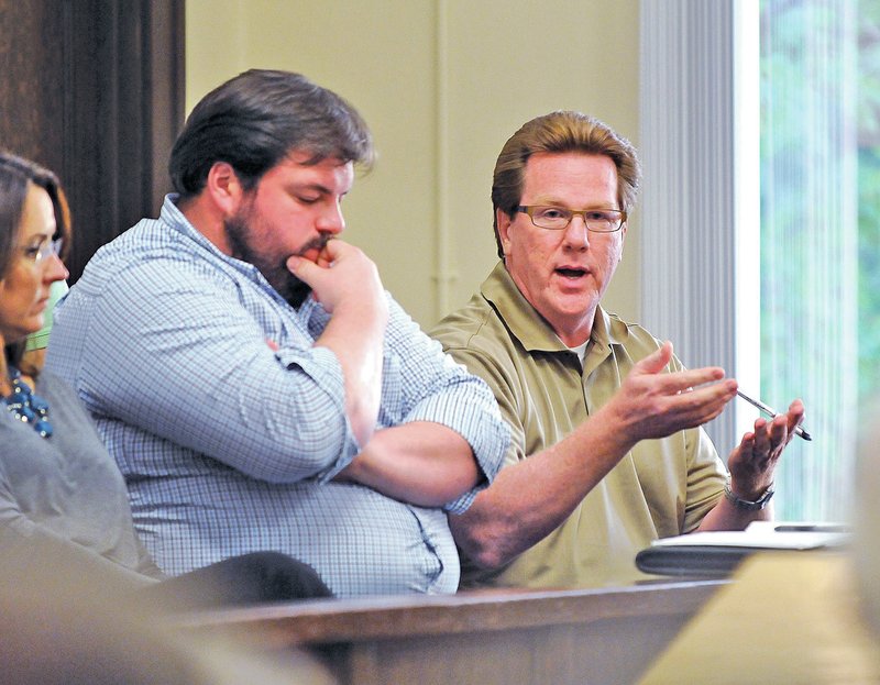 FILE PHOTO BEN GOFF &#8226; @NWABenGoff Tom Allen, right, Benton County Justice of the Peace for District 4, answers questions Monday during a public hearing about rural ambulance service at the county courthouse in Bentonville.