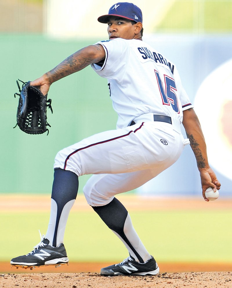  STAFF PHOTO ANDY SHUPE J.C. Sulbaran, Northwest Arkansas Naturals starter, delivers a pitch against the Tulsa Drillers during the first inning Tuesday at Arvest Ballpark in Springdale.