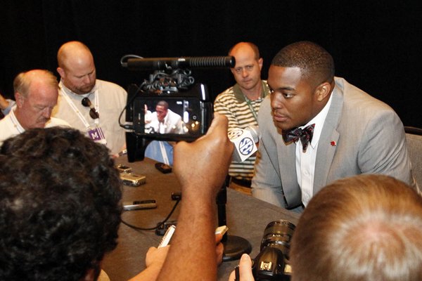 Arkansas defensive end Trey Flowers speaks to media at the Southeastern Conference NCAA college football media days on Wednesday, July 16, 2014, in Hoover, Ala. (AP Photo/Butch Dill)
