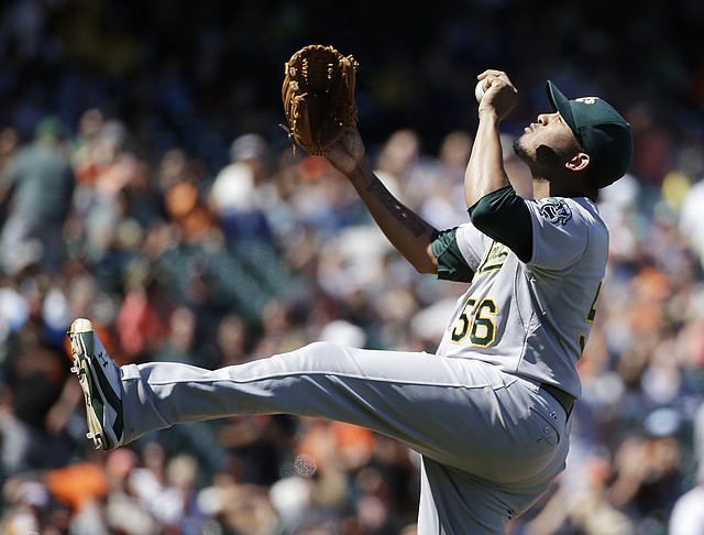 Oakland Athletics relief pitcher Fernando Abad celebrates at the end of their interleague baseball game against the San Francisco Giants Thursday, July 10, 2014, in San Francisco. Oakland won the game 6-1. 