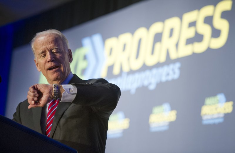 Vice President Joe Biden looks at his watch as he speaks in Washington, Wednesday,July 16, 2014, during Generation Progress's annual Make Progress National Summit. As Hillary Rodham Clinton promotes her book, liberals in the Democratic Party are elbowing into the 2016 presidential conversation. Potential Clinton rivals like Biden, Massachusetts Sen. Elizabeth Warren and Maryland Gov. Martin O'Malley are in the middle of a summertime tour of Democratic constituencies and campaigns, drawing contrasts to Clinton as she weighs a heavily anticipated second presidential bid.