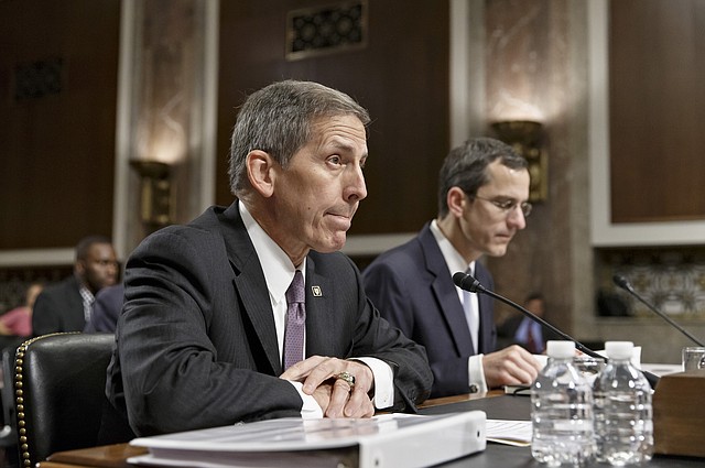 Veterans Affairs acting Secretary Sloan Gibson testifies on Capitol Hill in Washington, Wednesday, July 16, 2014, before the Senate Veterans' Affairs Committee hearing on the state of VA health care in the wake of revelations of neglect and delayed medical visits. He is accompanied by Assistant Deputy Undersecretary For Health For Administrative Operations Philip Matkowsky. 