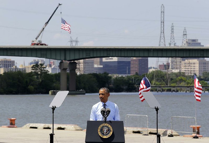 President Barack Obama speaks in front of the Interstate 495 bridge over the Christina River near Wilmington, Del., Thursday, July 17, 2014, to announce an initiative to increase private sector investment in the nation's infrastructure. The bridge was closed for emergency repairs last month after the discovery of four tilting support columns, and the federal government is helping pay for repairs. (AP Photo/Patrick Semansky)