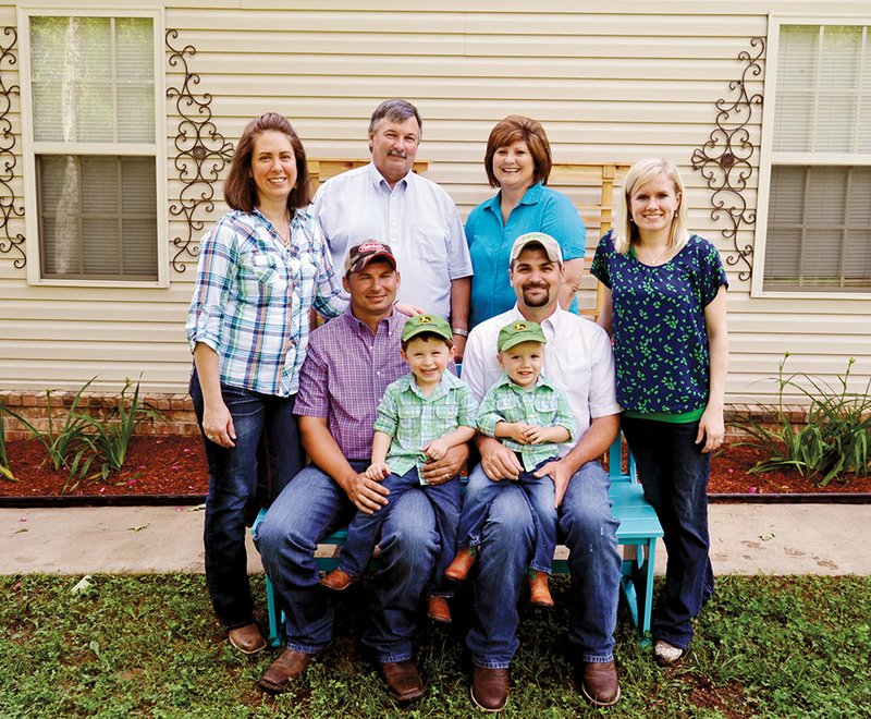 The Jimmy Hart Family of Springfield is the 2014 Conway County Farm Family of the Year. Doing business as Hart & Sons, LLC, the family includes Jimmy and his wife, Nancy; their son Todd Hart, his wife, Danna, and their 2-year-old son, Tyler; and son Greg Hart, his wife, Rachel, and their 2-year-old son, Cameron. Standing, from left, are Danna, Jimmy, Nancy and Rachel; and seated are Todd, holding Tyler, and Greg, holding Cameron. Jimmy and Nancy have two other children — Greg Hart and Ashley Mayor — who are not involved in the farm operation.