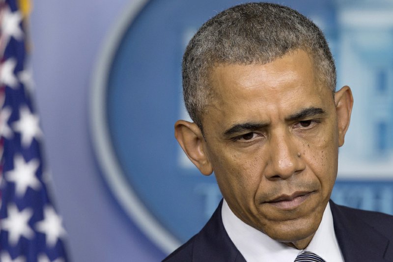 President Barack Obama pauses while speaking about the situation in Ukraine on Friday, July 18, 2014, in the Brady Press Briefing Room of the White House in Washington. Obama called for immediate ceasefire in Ukraine, demands credible investigation of downed plane.