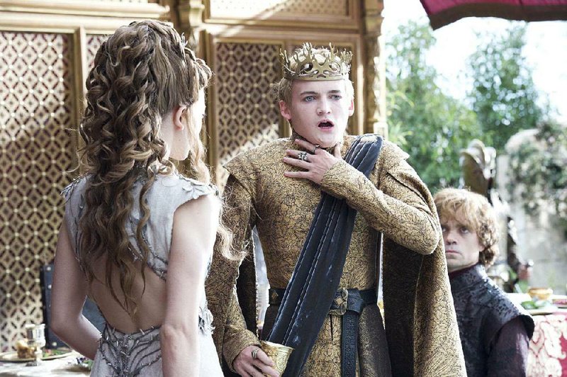 Game of Throne’s King Joffrey (Jack Gleeson, center) begins to feel a bit odd as Margaery (Natalie Dormer) and Tyrion (Peter Dinklage) look on. The HBO series topped Emmy nominations this season with 19.