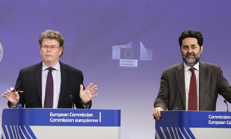 U.S. Chief Negotiator Dan Mullaney (left) and European Union Chief Negotiator Ignacio Garcia Bercero answer questions from reporters Friday at European Union headquarters in Brussels.