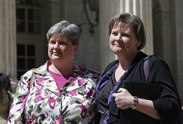 In the April 17, 2014, photo plaintiffs challenging Oklahoma's gay marriage ban Sharon Baldwin, left, and her partner Mary Bishop leave court following a hearing at the 10th U.S. Circuit Court of Appeals in Denver, Thursday, April 17, 2014. The three-judge panel of the 10th U.S. Circuit Court of Appeals in Denver on Friday, July 18, 2014, found a ban on same-sex marriage in Oklahoma violates the U.S. Constitution. In a Utah case, the court ruled June 25 that gay couples have a constitutional right to wed. 