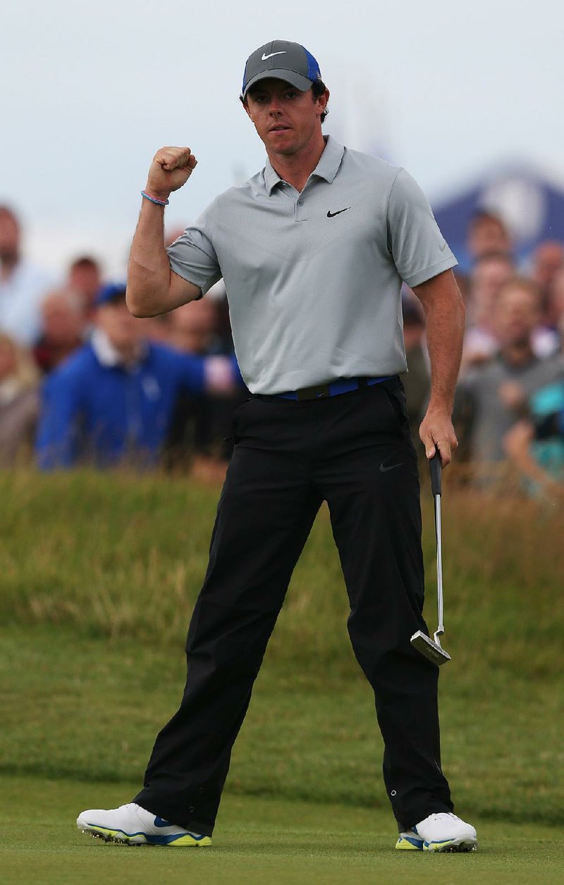 Rory McIlroy, who leads the British Open by six shots after three rounds, celebrates an eagle on No. 16 at Royal Liverpool on Saturday. McIlroy has led the tournament through all three rounds and added another eagle on No. 18 to go with three bogeys.