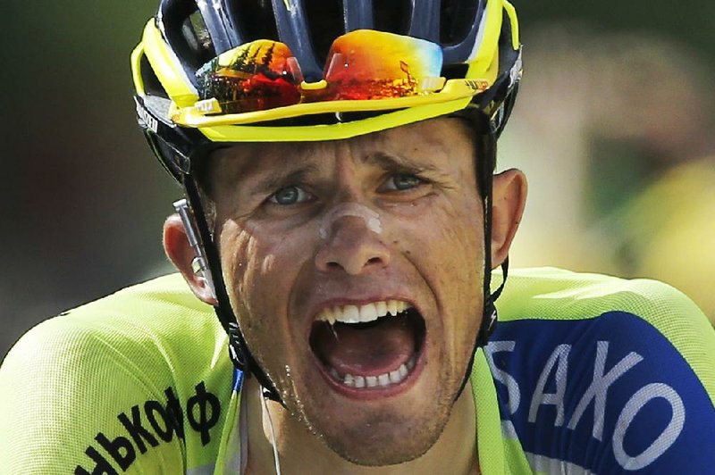 Polish rider Rafal Majka crosses the finish line to win the 14th stage of the Tour de France on Saturday in Risoul, France. Majka was second in Friday’s stage behind overall leader Vincenzo Nibali of Italy, who extended his lead despite a second-place finish.