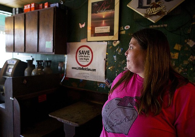 Nola Nysten, who has worked at Midtown Billiards for nine years, says she can’t imagine Little Rock officials changing the hours for private clubs. “This is where everybody goes. Everyone knows each other,” she said. A sign on the wall behind Nysten proclaims: “Support Little Rock’s 5 a.m. Clubs.”