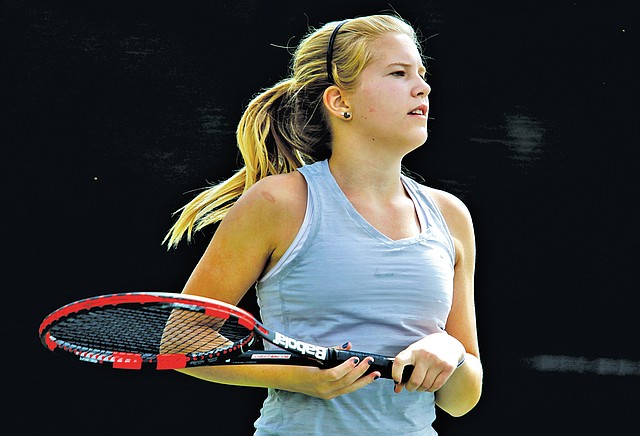  STAFF PHOTO JASON IVESTER Bessie Sullivan, 14, of Bella Vista pauses betwen points during her match on Saturday in the Mattel Summer Junior Tennis State Championship at Memorial Park in Bentonville.