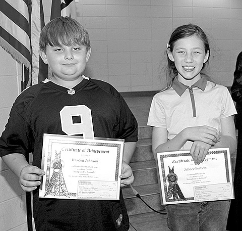 Submitted photo Haley Whitaker, front left, placed first in the Hot Springs Village Animal Welfare League&#8217;s 2014 Student Essay Contest. Whitaker was awarded the first-place prize of $100. The essay competition is an annual event open to all third-grade students from Fountain Lake, Jessieville and Mountain Pine elementary schools. The winners were recognized in assemblies at their respective schools. Rachel Vice, front right, placed third and received $25. Literacy teacher Kristy Riggs, back left, received a gift card for Home Plate Cafe. Also pictured is Molly Anne Lashmett of the AWL.