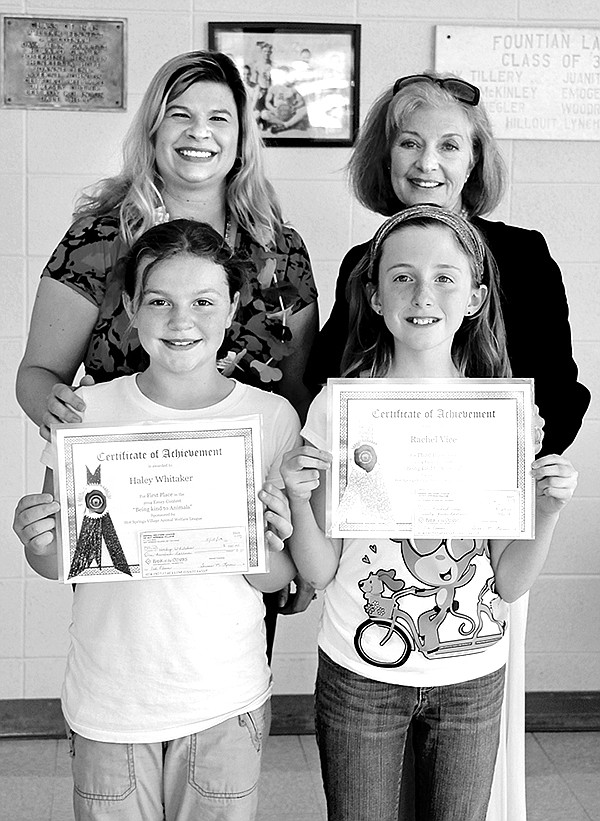 Submitted photo Jubilee Forbess, front right, placed second in the Hot Springs Village Animal Welfare League&#8217;s 2014 Student Essay Contest. Forbes was awarded the second-place prize of $50. The essay competition is an annual event open to all third grade students from Fountain Lake, Jessieville and Mountain Pine elementary schools. The winners were recognized in assemblies at their respective schools. Hayden Johnson, front left, earned an honorable mention.