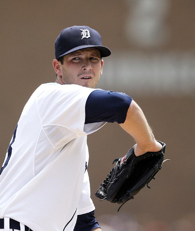 Detroit Tigers starting pitcher Drew Smyly throws during the first inning of a baseball game against the Cleveland Indians, Sunday, July 20, 2014 in Detroit. (AP Photo/Carlos Osorio)