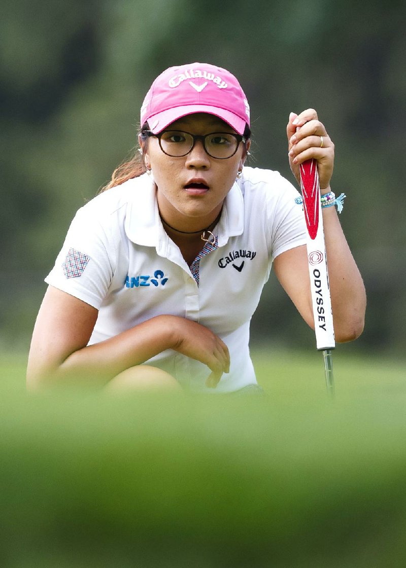 Lydia Ko, of New Zealand, reads a putt on the 17th hole during the final round of the Marathon Classic LPGA golf tournament at Highland Meadows Golf Club in Sylvania, Ohio, Sunday, July 20, 2014. (AP Photo/Rick Osentoski)