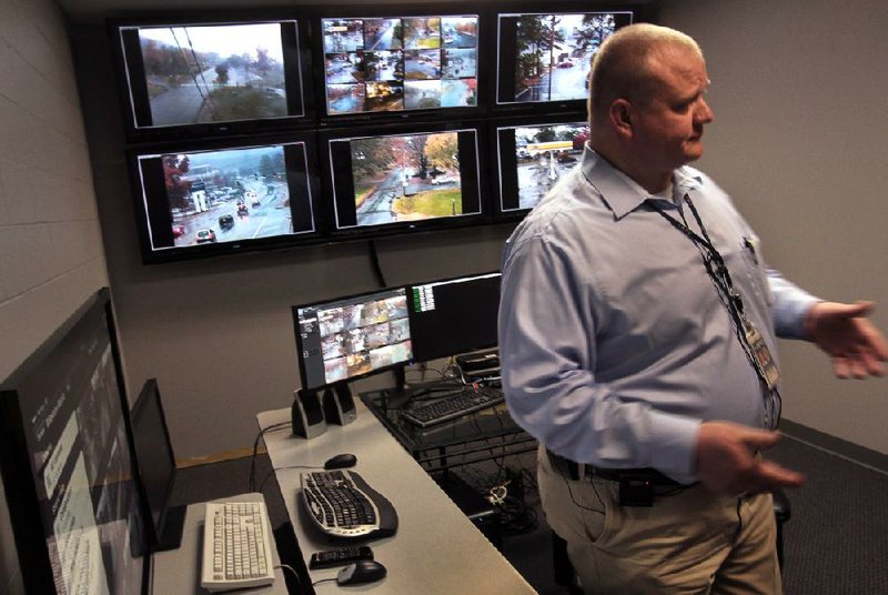 Arkansas Democrat-Gazette/BENJAMIN KRAIN --11/21/2013--
Lt. Casey Clark demonstrates the capabilities of 53 video cameras the Little Rock Police Department has placed in public areas around the city to deter and solve crimes by monitoring live streams from each location. The cameras can be easily moved to other locations and can broadcast prerecorded audio warnings and flash a blue light when suspicious activity occurs.