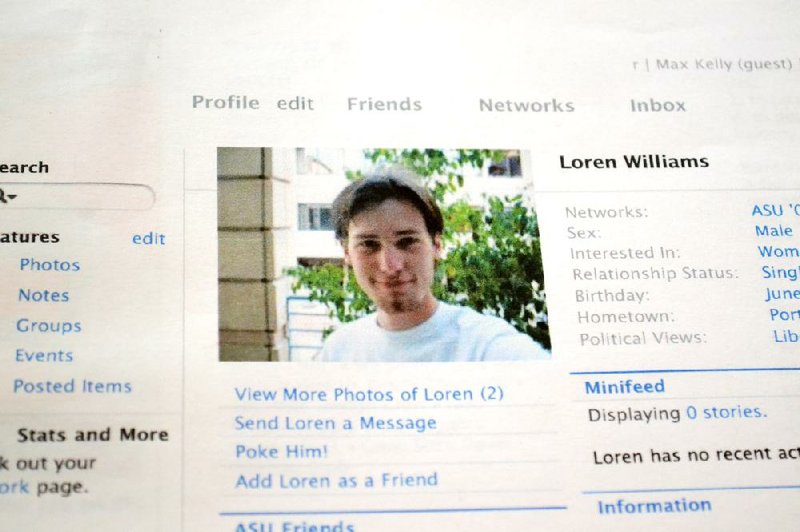 FILE - This Feb. 16, 2013 file photo shows a printout of the Facebook page for Loren Williams, now deceased, at the Beaverton, Ore. home of his mother, Karen Williams. Williams sued Facebook for access to Loren's account after he died in a 2005 motorcycle accident at the age of 22. The Uniform Law Commission on Wednesday, July 16, 2014 was expected to endorse a plan to automatically give loved ones access to — but not control of — all digital accounts, unless otherwise specified. (AP Photo/Lauren Gambino, File)