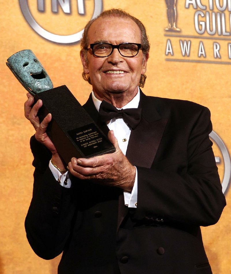 FILE - James Garner holds the 41st annual life achievement award backstage at the 11th annual Screen Actors Guild Awards in this Saturday, Feb. 5, 2005 file photo taken in Los Angeles. (AP Photo/Chris Pizzello, File)