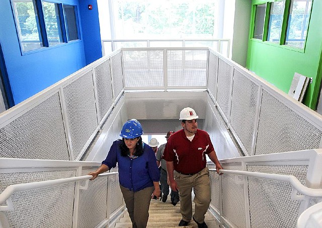 Arkansas Democrat-Gazette/BENJAMIN KRAIN --06/25/14--
North Little Rock School District deputy superintendent Beth Stewart, left, tours the district's new Meadow Park Elementary School with principal Chris Sierra, right, and other district administrators.  Amboy, Lakewood and Boone Park Elementary schools as well as North Little Rock High School are also new construction projects for the North Little Rock School District.