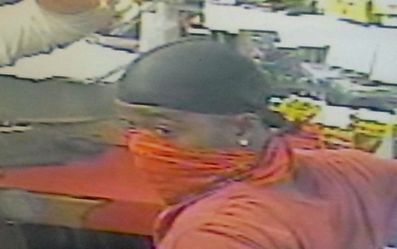 Surveillance footage released from the Kwik Check Food Mart, located at 800 N. Bryant St. in Pine Bluff, shows one of two robbers who purportedly robbed the business at gunpoint on Saturday, July 19, 2014. Pine Bluff police are asking for the public's help with identifying the suspects.