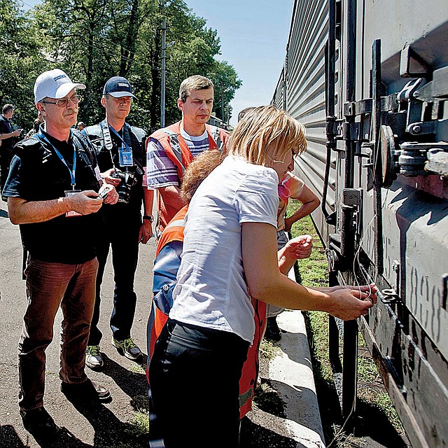 A train car is locked as a refrigerated train with bodies of the passengers of Malaysia Airlines Flight 17 prepares to depart the station Monday in Torez, Ukraine, about 9 miles from the plane’s crash site.