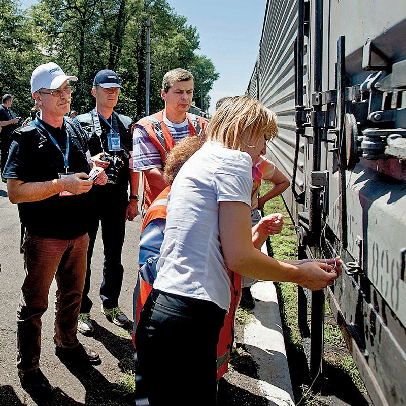 A train car is locked as a refrigerated train with bodies of the passengers of Malaysia Airlines Flight 17 prepares to depart the station Monday in Torez, Ukraine, about 9 miles from the plane’s crash site.