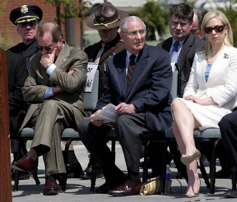 In this May 11, 2006, file photo, attending dignitaries including Oregon Gov. Ted Kulongoski, left, former Gov. Vic Atiyeh, center, and 2002 Miss America Katie Harmon sit, as the names of officers killed in the line of duty are read during the Oregon Law Enforcement Memorial ceremony at the new public-safety academy grounds in Salem, Ore. Atiyeh, Oregon's last Republican governor who shepherded the state through a deep recession during two terms in the 1980s, died Sunday, July 20, 2014, a family spokesman said. The former governor died at 8:15 p.m. PDT at Portland's Providence St. Vincent Medical Center of complications from renal failure, said Denny Miles, who had formerly served as Atiyeh's press secretary. He was 91.