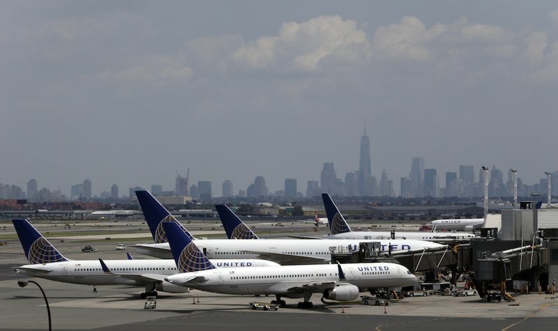 United Airlines jets are seen at the gate at Newark Liberty International Airport, Tuesday, July 22, 2014, in Newark, N.J. In a sign of increased caution about flying near combat zones, U.S. and European airlines halted flights to Israel Tuesday after a rocket landed near Tel Aviv's Ben Gurion Airport. Delta Air Lines and United Airlines suspended service between the U.S. and Israel indefinitely. The actions come days after a Malaysia Airlines jet was shot down over eastern Ukraine with 298 people on board. 