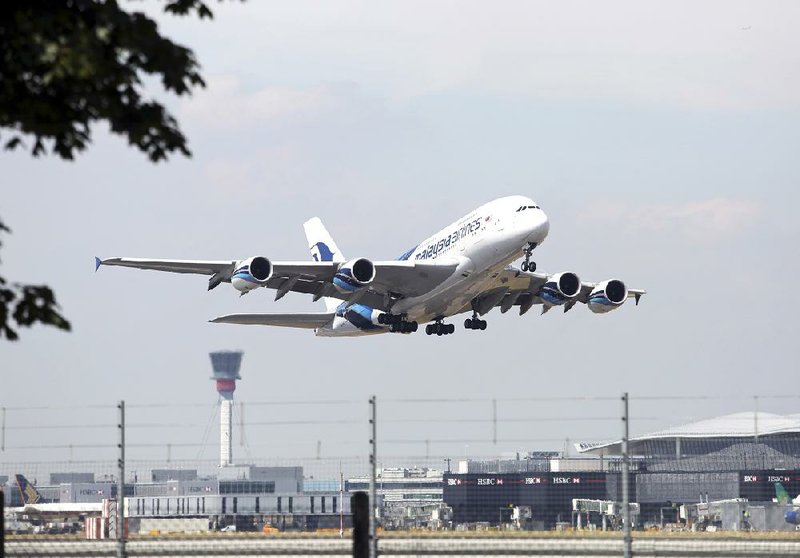 An Airbus A380 aircraft, produced by Airbus Group NV and operated by Malaysia Airlines System Bhd., takes-off from Heathrow airport's Terminal 4 in London, U.K., on Friday, July 18, 2014. Malaysian Air's Flight MH17, carrying 298 passengers and crew, was shot down yesterday over eastern Ukraine in an attack that the government in Kiev blamed on pro-Russian rebels. Photographer: Chris Ratcliffe/Bloomberg