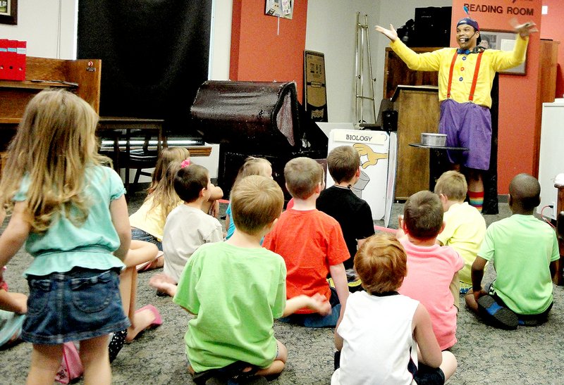 Courtesy of Diane S. Hine Tommy Diaz, aka Tommy Terrific, performs his wacky magic show July 12 at the Bella Vista Public Library as part of the 2014 Summer Reading Program.