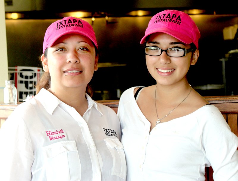 LYNN KUTTER ENTERPRISE-LEADER Elizabeth Segura, left, manages the new IXTAPA Mexican restaurant in Farmington and her daughter, Vanessa, 16, a Farmington High student, helps. The restaurant is owned by Segura&#8217;s mother, who has owned a Mexican restaurant with the same name in Chicago, Ill., for 19 years.