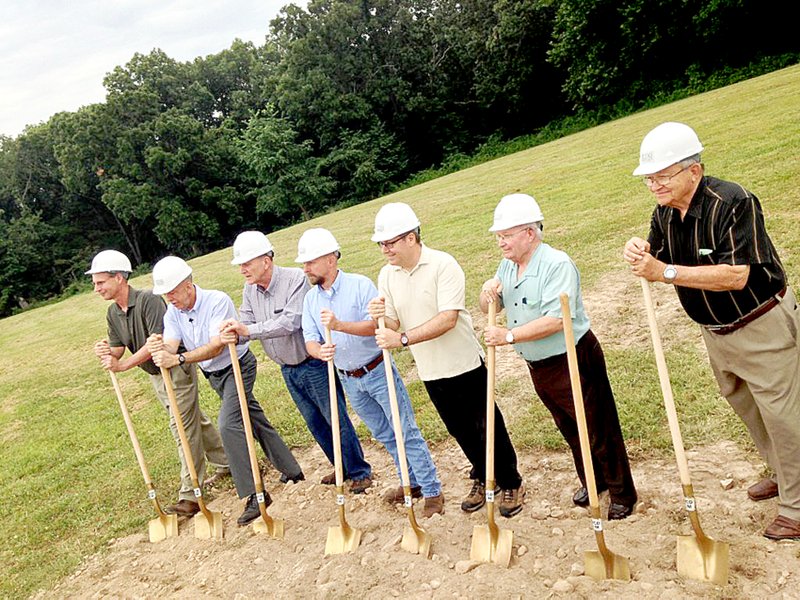 Submitted Ground was broken July 16 at the future site of Village Bible Evangelical Free Church on Forest Hills Boulevard. From left to right are Al Frank, regional associate superintendent with the Evangelical Free Church of America Central District; Mark Voll, pastor of Village Bible; Phil Phillips, Building Committee chair; Rusty Smith of Joplin Construction Design and Management, project manager; Mike Conyers, head trustee at Village Bible; Don Rogan, church moderator; and Frank Anderson, mayor of Bella Vista.