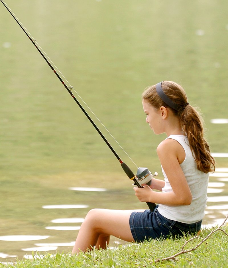 Photo by Randy Moll Mya Holland, 11, was enjoying an afternoon of fishing at Crystal Lake on Friday.