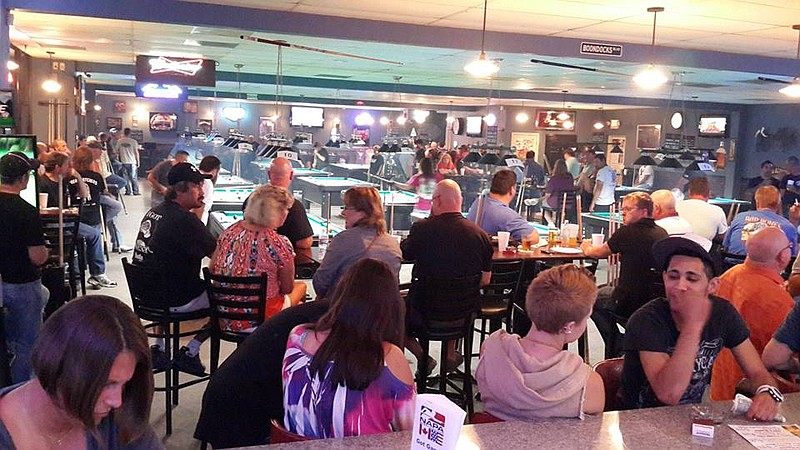Submitted photo BILLIARDS BATTLE: Contestants gather at Boondocks Pool Hall for the three-day tournament.