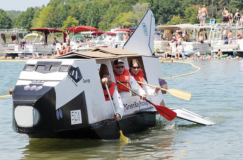 A team from Green Bay Packaging heads for the finish line in last year’s World Championship Cardboard Boat Races on Greers Ferry Lake in Heber Springs. This year’s event will start at 10 a.m. Saturday on Sandy Beach and will feature several other activities, including watermelon-eating and sand-sculpting contests and beach volleyball.